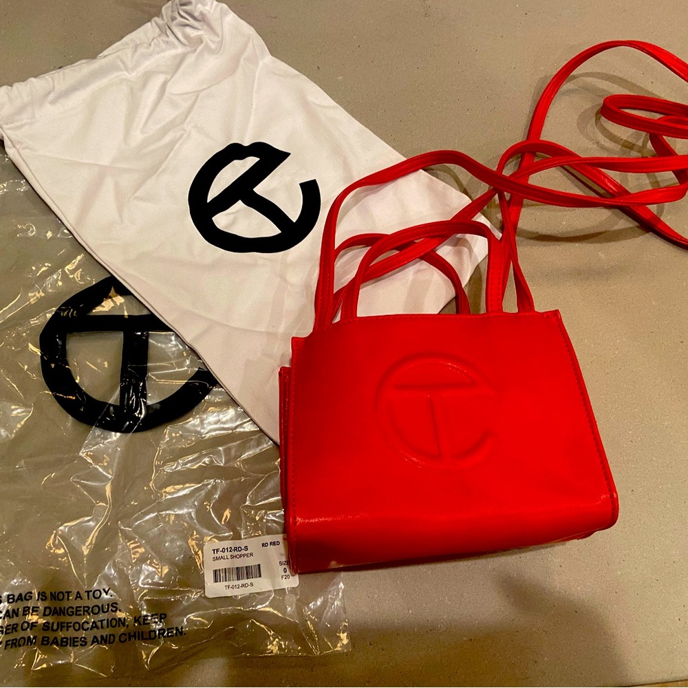 Telfar red mini tote bag never been used. Original packaging and dust cover bag.